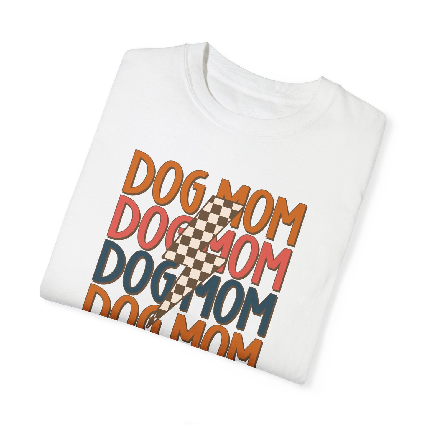 The Checkered Vibes Dog Mom Tee by Banks + Cove is a folded white T-shirt with DOG MOM in retro colors and a checkered lightning bolt, perfect for showing your Dog Mom Energy.