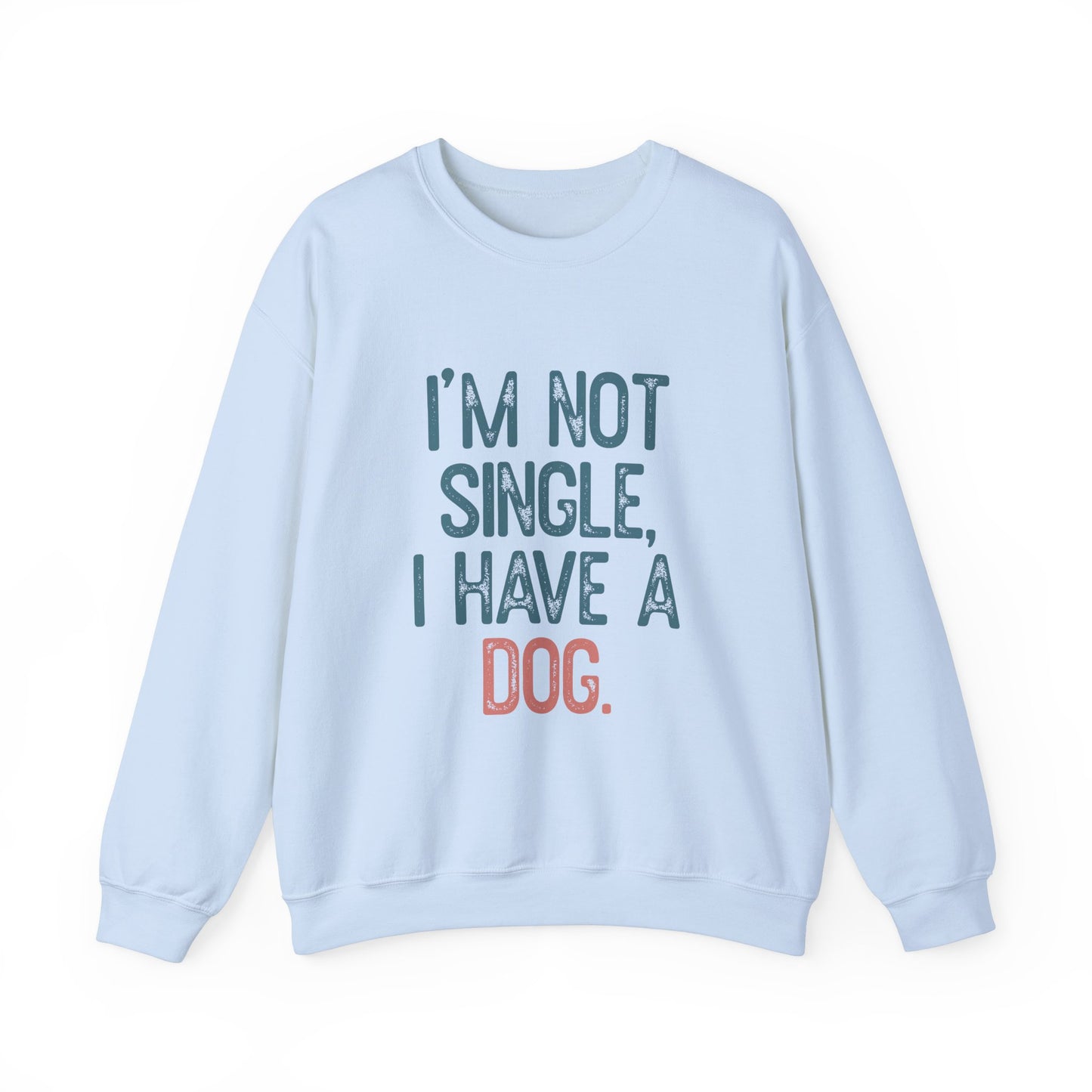 The Dog Lover Crewneck Sweatshirt by Printify features the phrase IM NOT SINGLE, I HAVE A DOG in bold, with DOG highlighted in orange on light blue fabric. Ideal for dog owners, its set against a simple white background, making it a must-have gift for canine enthusiasts.