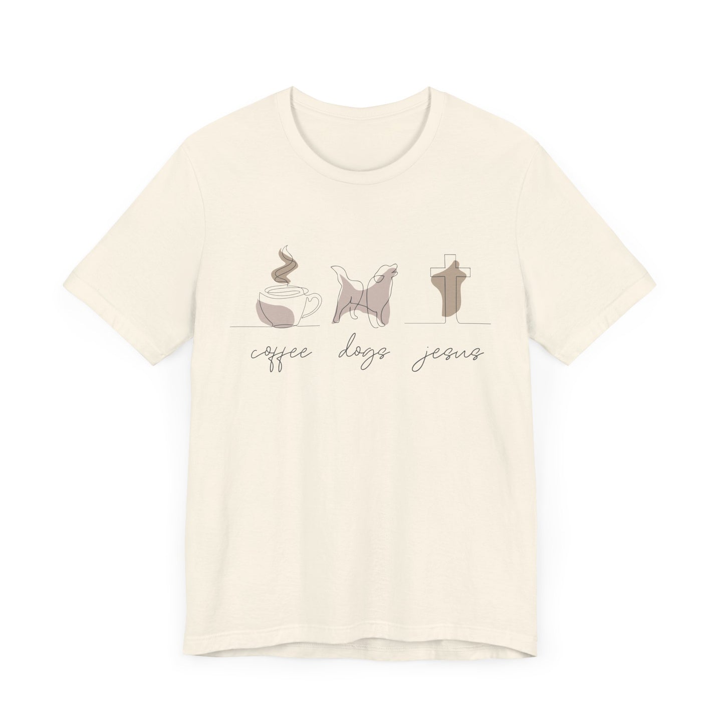 The Coffee Dogs Jesus Tee by Printify is a unisex beige shirt featuring minimalist illustrations of a coffee cup, dog, and cross, with the words coffee, dogs, and Jesus in cursive below each image. Its crafted from soft Airlume cotton.