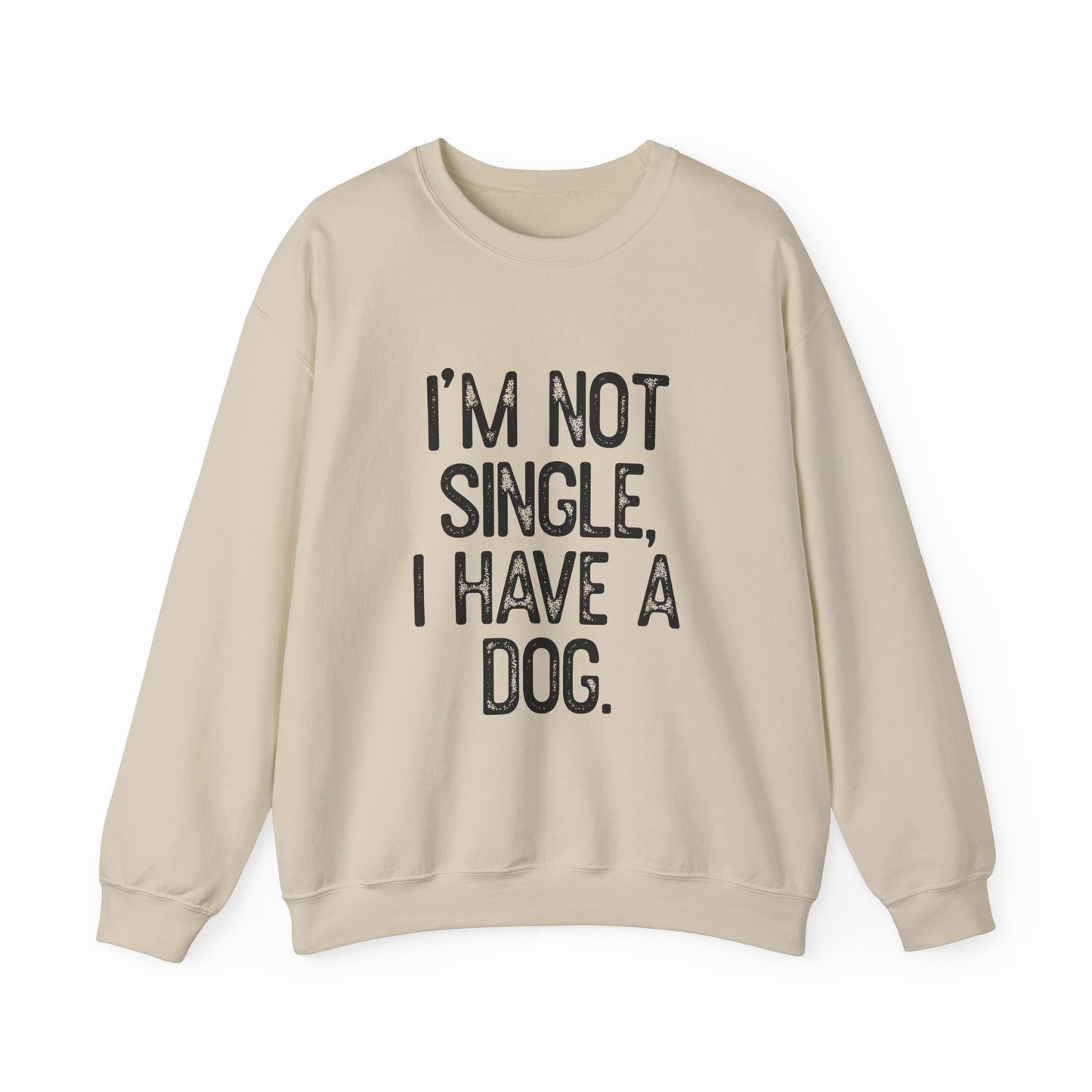 The Printify Funny Dog Lover Crewneck Sweatshirt in beige, with bold black text stating Im Not Single, I Have A Dog, is perfect for dog lovers and makes a great statement piece for anyone who cherishes their furry companions.