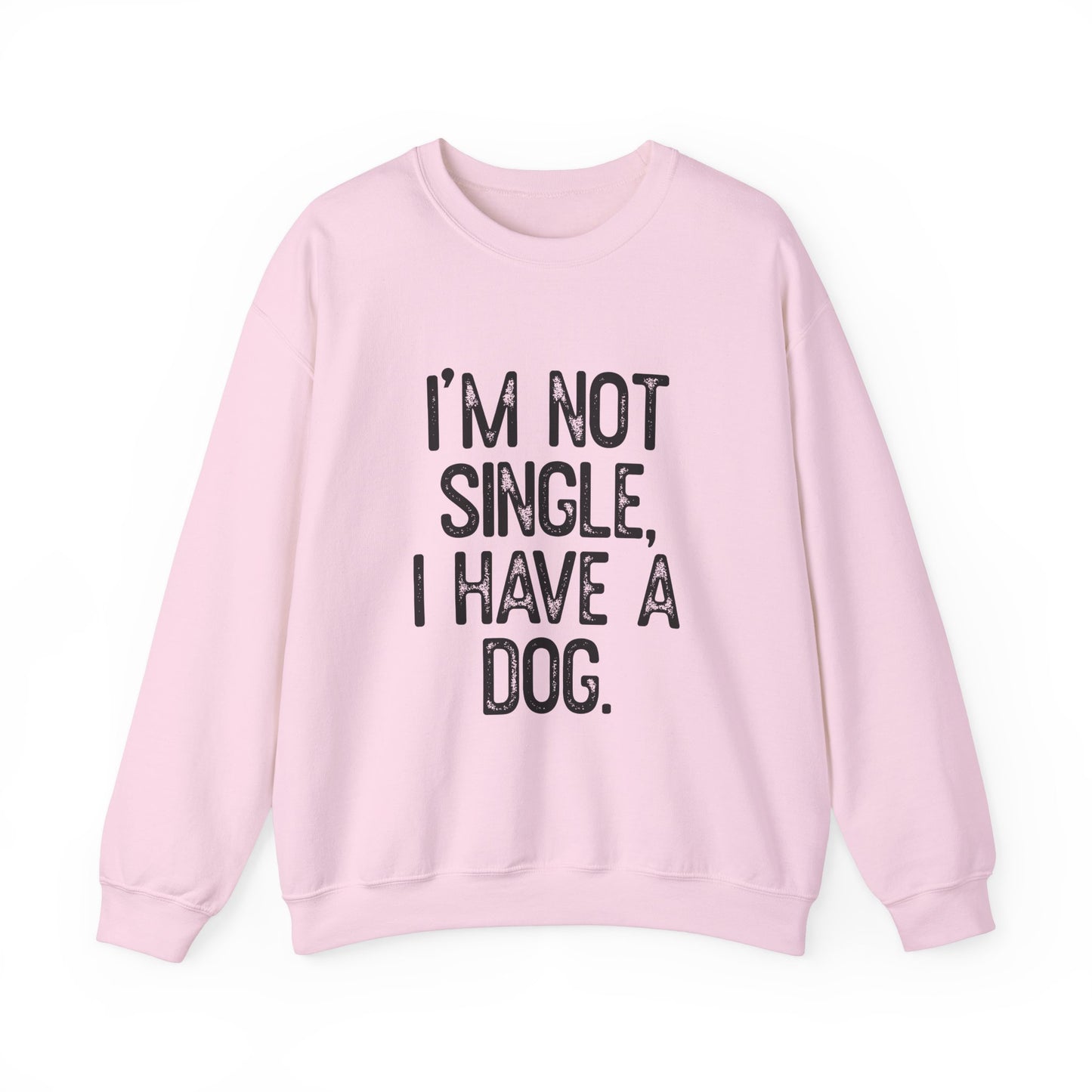 The Printify Funny Dog Lover Crewneck Sweatshirt in light pink features the bold Im Not Single, I Have A Dog text, making it a cozy choice for dog lovers.