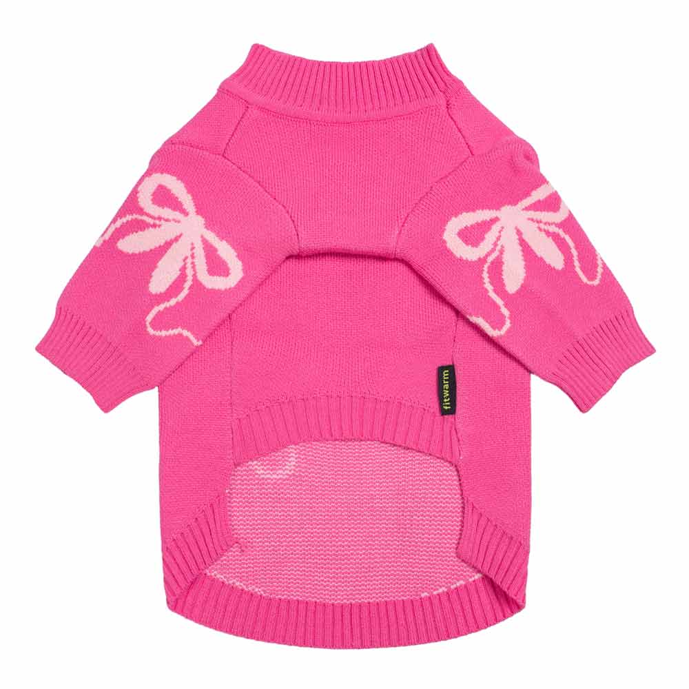 The Fitwarm Bowknot Dog Sweater is bright pink with a cozy circular neckline and short sleeves. It features a charming bowknot pattern on each sleeve and includes a small black tag on one side. The soft knit fabric is perfect for keeping your furry friend warm.