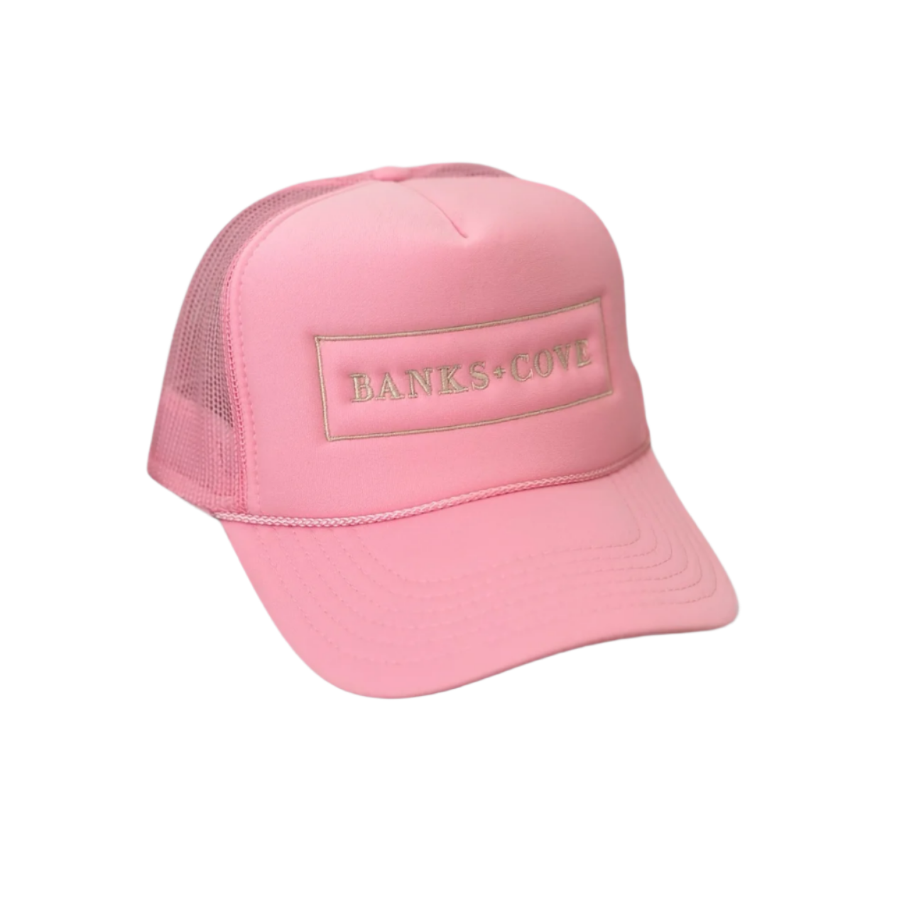 The Pink Banks+Cove Trucker Hat features mesh sides and a front panel with BANKS + COVE in gold lettering on a gray background, making it a stylish accessory for animal lovers to showcase their unique pet pride.
