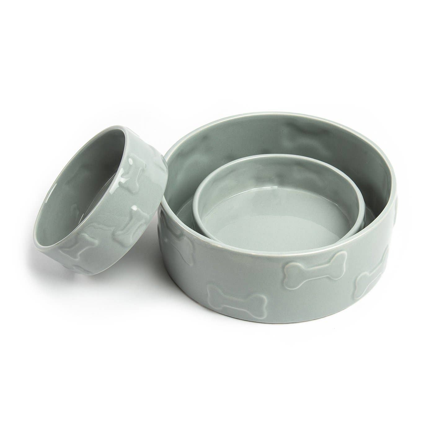 Introducing the Manor Grey Pet Bowl set from Park Life Designs: a trio of premium ceramic dog bowls, each featuring a stylish bone pattern. These designer bowls nest seamlessly from small to large on a pristine white background.