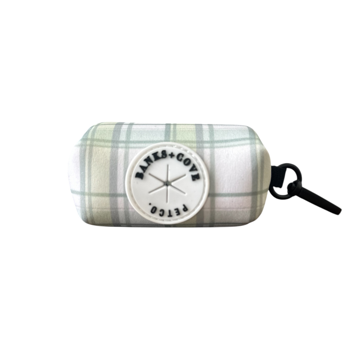 The Plaid About You waste bag holder by Banks + Cove features a rectangular plaid pattern with a BANKS + COVE PETCO patch and includes a black clip for easy attachment, offering tangle-free bag retrieval.
