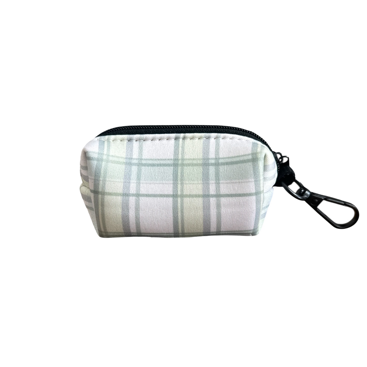 The Plaid About You Waste Bag Holder by Banks + Cove is a small rectangular pouch with a green and white plaid pattern, black zipper, and metal clasp for easy bag retrieval, set against a plain white background.