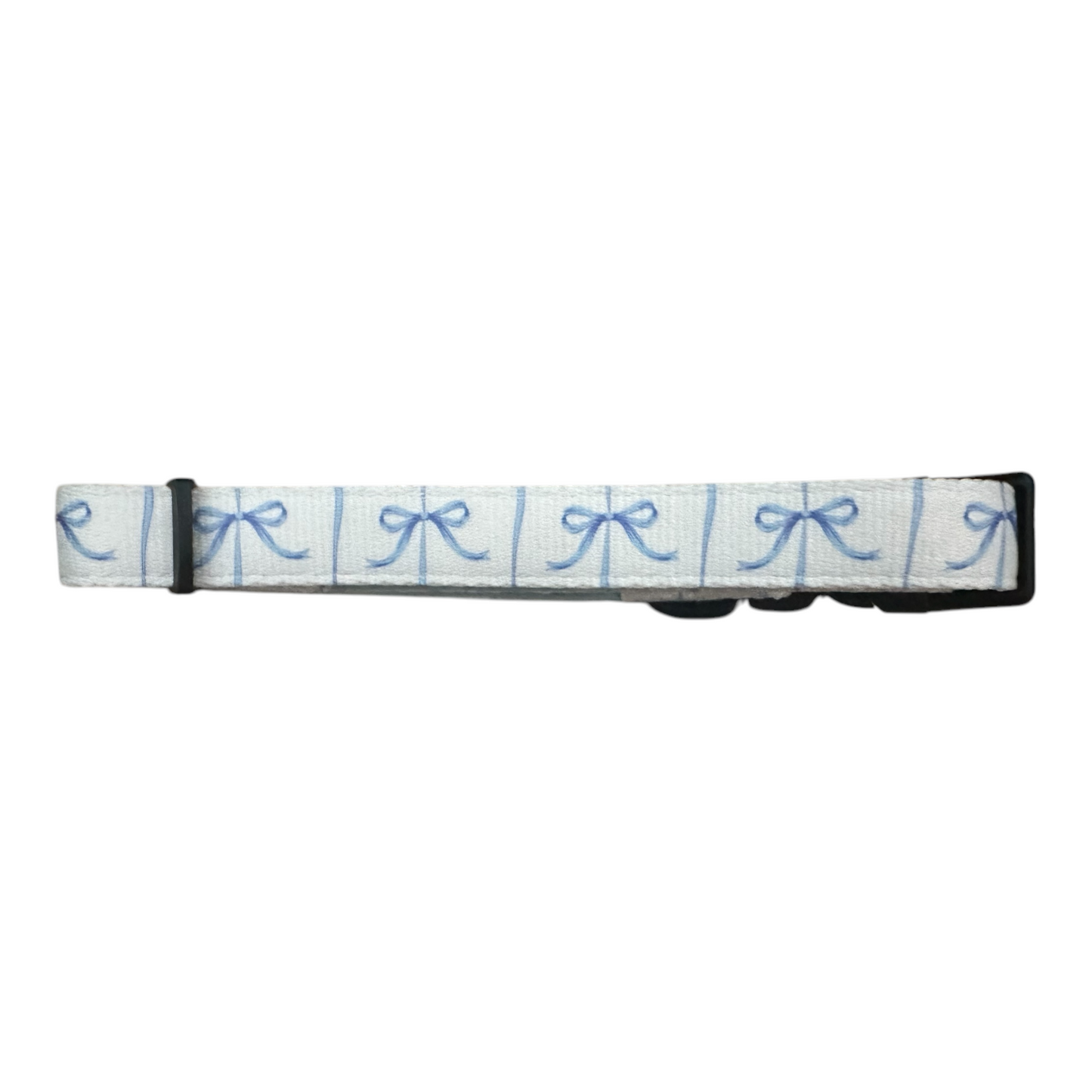 This fashionable dog accessory from Banks + Cove is a white belt with a blue bows pattern in square frames and a black buckle, resembling the Distinguished Gentlepup Dog Collar.