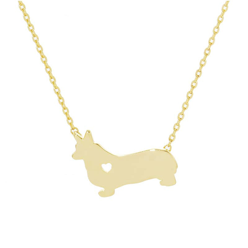 The Corgi Love Necklace by Banks + Cove features a gold-tone pendant in the shape of a corgi dog with a charming heart cutout. Its perfect for dog-loving jewelry enthusiasts and elegantly hangs from a delicate chain.